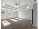 Main bedroom with trey ceilings, carpeted floors, and a doorway to the main bath at 3170 Old Hwy 92 Dr, Acworth, GA 30102