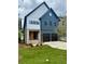 Charming two-story home features two car garage, brick accents, and manicured lawn at 2587 Apple Valley Rd, Brookhaven, GA 30319