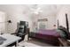 Comfortable bedroom with desk and chair, providing a great space to relax and work at 1415 Swiftwater Cir, Mcdonough, GA 30252