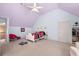 Spacious bedroom with decorative flower rug, offering a comfortable and inviting atmosphere at 1415 Swiftwater Cir, Mcdonough, GA 30252