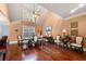Bright dining room boasts high ceilings, hardwood floors, and large windows for natural light at 1415 Swiftwater Cir, Mcdonough, GA 30252