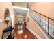 Grand foyer features hardwood floors, staircase, and an open view to the dining area at 1415 Swiftwater Cir, Mcdonough, GA 30252