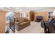 Upstairs loft featuring a comfortable seating area, carpeted floors, and plenty of natural light at 1415 Swiftwater Cir, Mcdonough, GA 30252