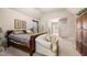 Comfortable main bedroom with a sitting area, carpeted floors, and access to an en-suite bathroom at 1415 Swiftwater Cir, Mcdonough, GA 30252