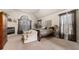 Cozy main bedroom with a fireplace, large windows, and comfortable decor at 1415 Swiftwater Cir, Mcdonough, GA 30252