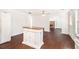 Spacious, bright kitchen with an island, new floors, white walls and appliances, with abundant natural light at 5520 Glore Sw Dr, Mableton, GA 30126