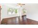 Bright living room features new floors, white walls, fireplace with brick surround, and abundant natural light at 5520 Glore Sw Dr, Mableton, GA 30126