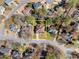 An aerial view of a home showing the location of the property with mature trees and landscaping at 960 Whitehawk Trl, Lawrenceville, GA 30043