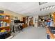 Finished basement area used as an office with carpeted floors, shelving, a desk, and good lighting at 960 Whitehawk Trl, Lawrenceville, GA 30043