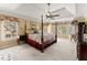 Spacious primary bedroom with tray ceiling, ceiling fan, and natural light at 960 Whitehawk Trl, Lawrenceville, GA 30043