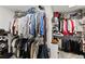 Organized walk-in closet with ample shelving and hanging space for clothes and accessories at 960 Whitehawk Trl, Lawrenceville, GA 30043