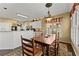 Bright dining room featuring hardwood floors, large windows, and views into the eat-in kitchen at 960 Whitehawk Trl, Lawrenceville, GA 30043