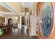 Grand foyer with hardwood floors, high ceilings, staircase and decorative glass front door at 960 Whitehawk Trl, Lawrenceville, GA 30043