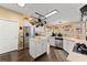 Bright kitchen with white cabinets, hardwood floors, stainless steel appliances, and a center island at 960 Whitehawk Trl, Lawrenceville, GA 30043