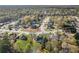 Aerial shot showing the home's location within a peaceful neighborhood with mature trees and landscaping at 115 Dearing Woods Way, Covington, GA 30014