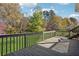 Open backyard deck offers peaceful views of spacious yard with lush, mature trees and landscaping at 115 Dearing Woods Way, Covington, GA 30014