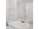Clean bathroom featuring a toilet, sink and vanity with a large mirror at 115 Dearing Woods Way, Covington, GA 30014