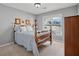 Charming bedroom with a comfortable bed and bright windows at 115 Dearing Woods Way, Covington, GA 30014