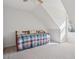 Attic bedroom with vaulted ceilings, light carpet, and a cozy daybed at 115 Dearing Woods Way, Covington, GA 30014