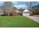 Lovely home with a well-manicured lawn and a convenient two-car garage at 115 Dearing Woods Way, Covington, GA 30014