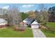 Charming home featuring a well-maintained lawn, attached garage, and inviting curb appeal at 115 Dearing Woods Way, Covington, GA 30014
