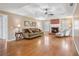 Spacious living room with a cozy fireplace, hardwood floors, and coffered ceiling at 115 Dearing Woods Way, Covington, GA 30014