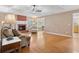 Bright living room with hardwood floors and a brick fireplace at 115 Dearing Woods Way, Covington, GA 30014