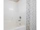 Bright white shower stall with updated fixtures and floral wallpaper at 115 Dearing Woods Way, Covington, GA 30014