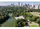 Scenic aerial view showcasing lush greenery, a lake, and the city skyline, offering a tranquil escape at 31 Lafayette Ne Dr, Atlanta, GA 30309