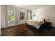 Spacious bedroom featuring hardwood floors and natural light from windows at 31 Lafayette Ne Dr, Atlanta, GA 30309