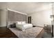Spacious bedroom with a decorative wall and a cozy seating area near the fireplace at 31 Lafayette Ne Dr, Atlanta, GA 30309