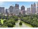 Stunning city view showcasing a blend of green spaces, a tranquil lake, and iconic buildings in the skyline at 31 Lafayette Ne Dr, Atlanta, GA 30309