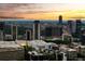 Striking cityscape view featuring modern high-rise buildings and a beautiful sunset backdrop in an urban setting at 31 Lafayette Ne Dr, Atlanta, GA 30309