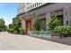 Upscale building exterior with a modern entrance, featuring greenery, a glass sign, and brick architecture at 31 Lafayette Ne Dr, Atlanta, GA 30309