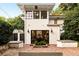 Exterior view of the home with French doors, windows, and a brick patio at 31 Lafayette Ne Dr, Atlanta, GA 30309