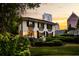 Stunning two-story home with manicured landscaping and a picturesque city view at sunset at 31 Lafayette Ne Dr, Atlanta, GA 30309