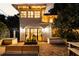 Backyard patio with lighting and view into home through french doors and exterior lighting at 31 Lafayette Ne Dr, Atlanta, GA 30309