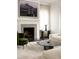 Close up of the fireplace with unique tilework, artwork and table at 31 Lafayette Ne Dr, Atlanta, GA 30309