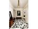 Hallway featuring elegant wall paneling, designer lighting, and striking geometric flooring at 31 Lafayette Ne Dr, Atlanta, GA 30309