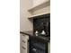 Kitchenette featuring black marble countertops, wine cooler, coffee machine and open shelving at 31 Lafayette Ne Dr, Atlanta, GA 30309