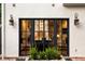 Black metal french doors from patio view the marble countertops in the gourmet kitchen at 31 Lafayette Ne Dr, Atlanta, GA 30309
