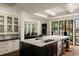 Spacious kitchen featuring an island with marble countertops and steel appliances at 31 Lafayette Ne Dr, Atlanta, GA 30309