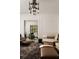 Beautiful living room featuring stylish furniture, TV, and unique chandelier lighting at 31 Lafayette Ne Dr, Atlanta, GA 30309