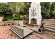 Outdoor patio area showcasing a decorative fireplace with stone surround and wooden seating at 31 Lafayette Ne Dr, Atlanta, GA 30309