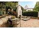 Outdoor living space featuring a unique fireplace, stone patio, and outdoor furniture at 31 Lafayette Ne Dr, Atlanta, GA 30309