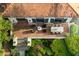 Overhead view of brick patio with outdoor dining, comfortable seating, and lush, manicured landscaping at 31 Lafayette Ne Dr, Atlanta, GA 30309