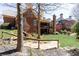 Beautiful brick home with a spacious backyard featuring mature trees and lush greenery at 5352 Lacosta Ln, Alpharetta, GA 30022