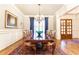 Traditional dining room with hardwood floors, and a view of the entry way at 5352 Lacosta Ln, Alpharetta, GA 30022