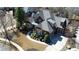 Elegant home with lush landscaping, a circular driveway, and a three-car garage at 5352 Lacosta Ln, Alpharetta, GA 30022