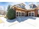 Attached three-car garage with stylish doors and well-maintained landscaping at 5352 Lacosta Ln, Alpharetta, GA 30022